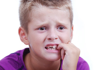 Stress expression on little blond kid's face